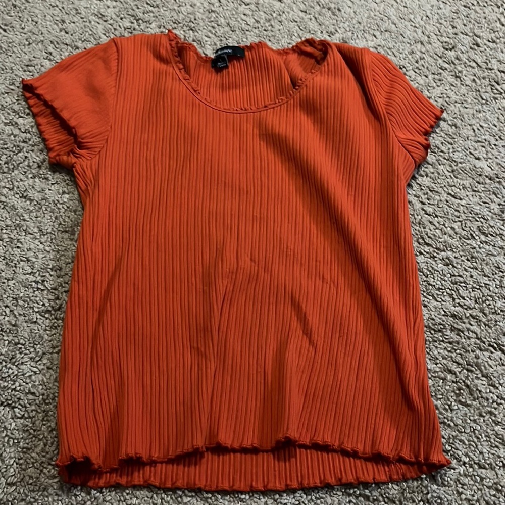 Orange ribbed L top from track23. Runs small and is a crop top.